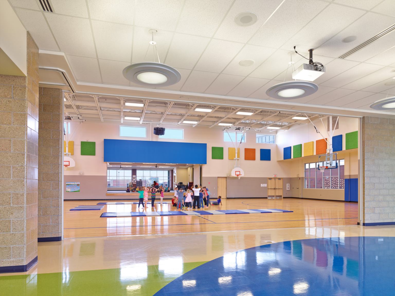 gymnasium at middle school with colorful design throughout exciting students gymnasium at middle school with colorful design throughout exciting students