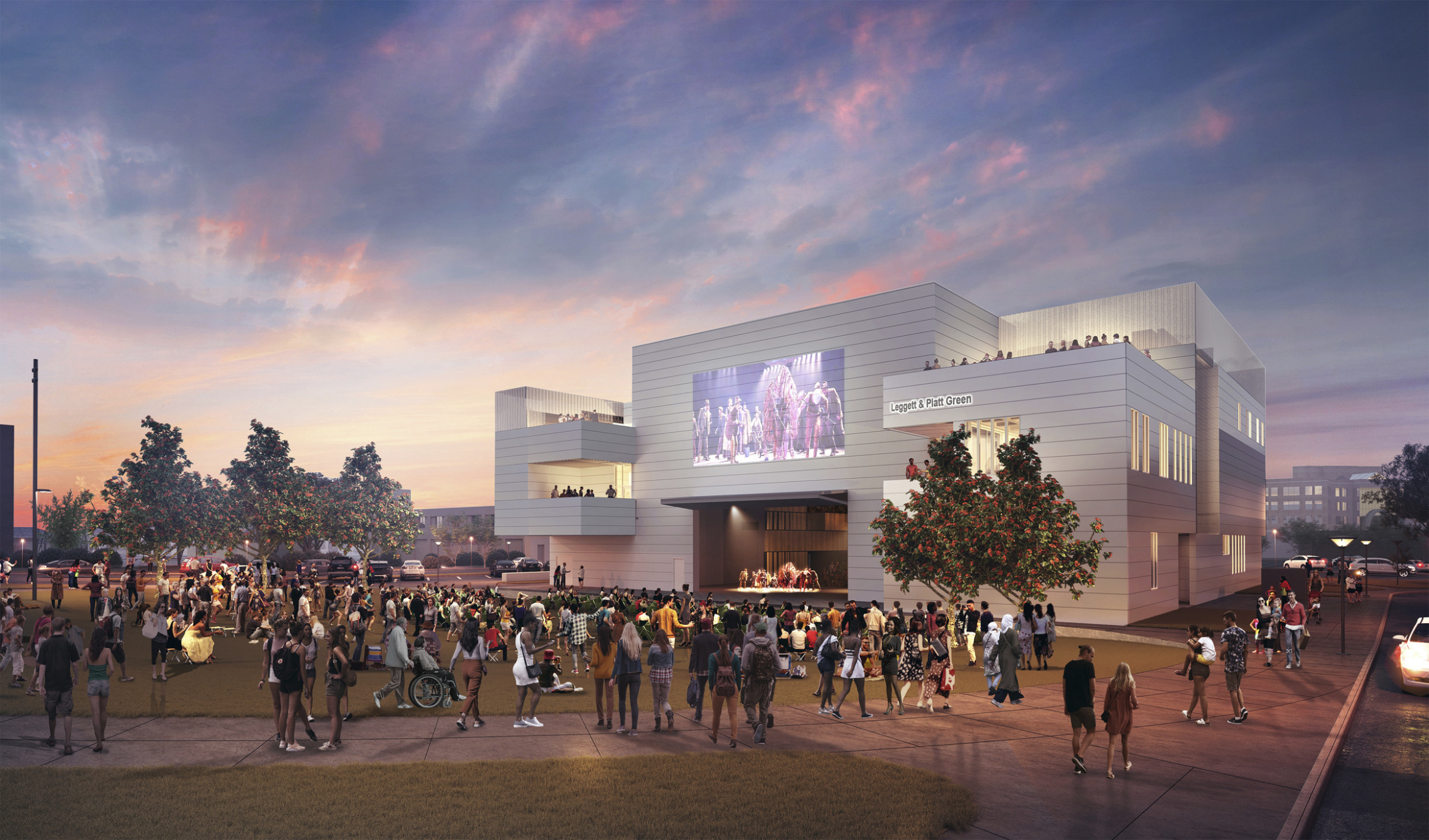 Cornell Arts Complex illuminated at dusk with a digital facade illustration