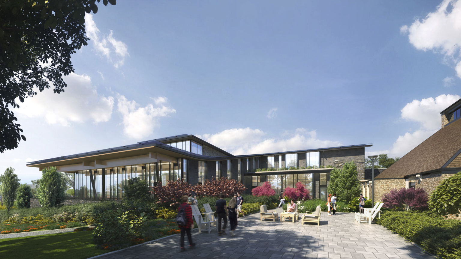 Backside of the dining facility with outdoor seating and floral landscaping at Swarthmore College Dining and Community Commons. Backside of the dining facility with outdoor seating and floral landscaping at Swarthmore College Dining and Community Commons.