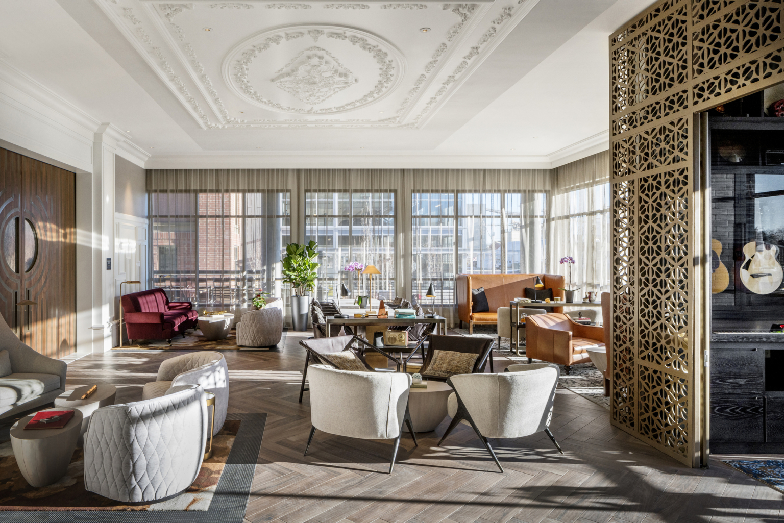 lobby with white seating and ornate ceiling with crown molding at the The Elizabeth Hotel, Autograph Collection by Marriott