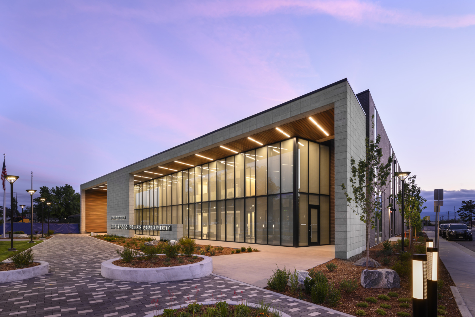 the front entrance of engelewood police station at dusk