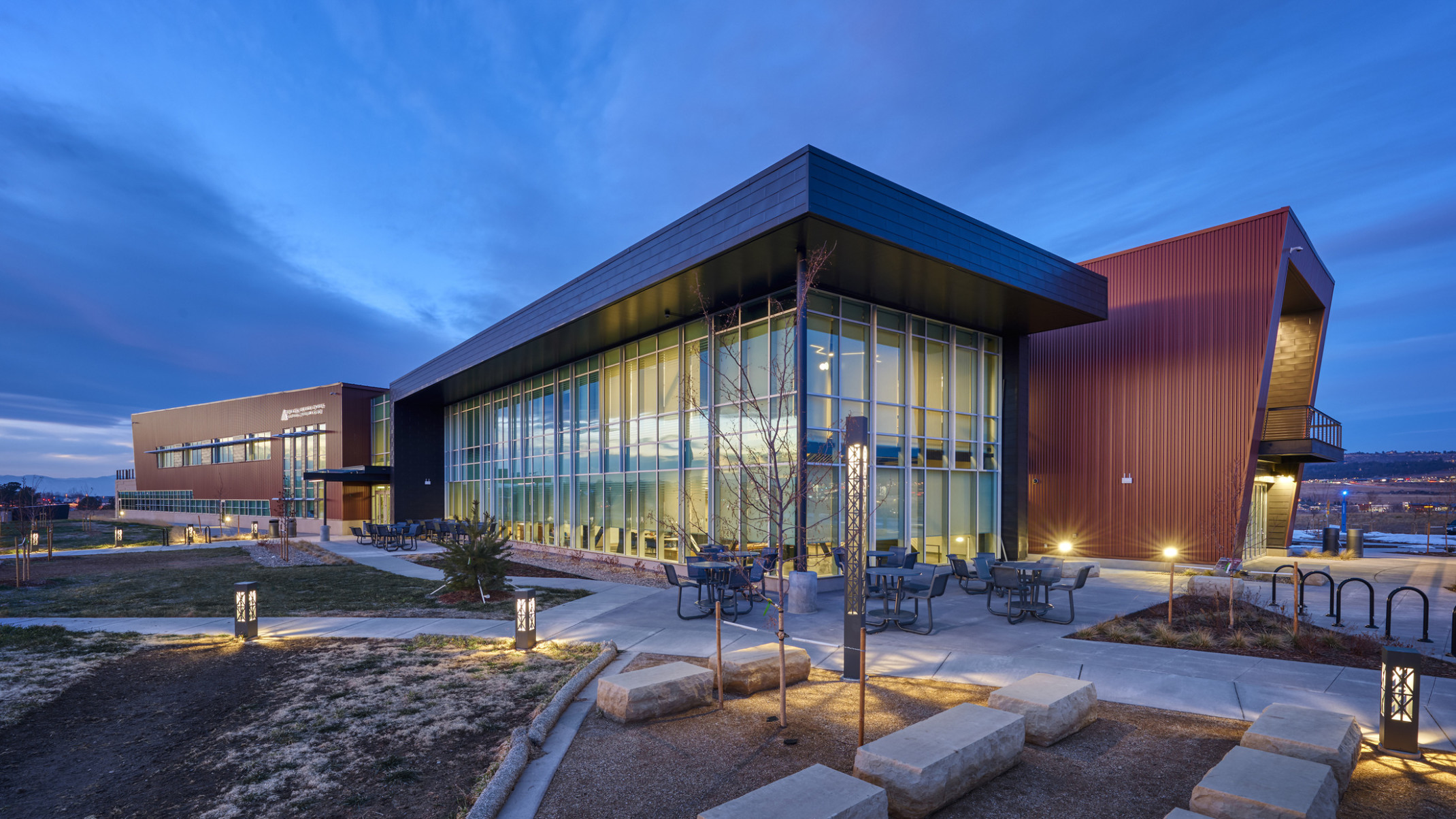 illuminated glass facade of Arapahoe Community College Sturm Campus