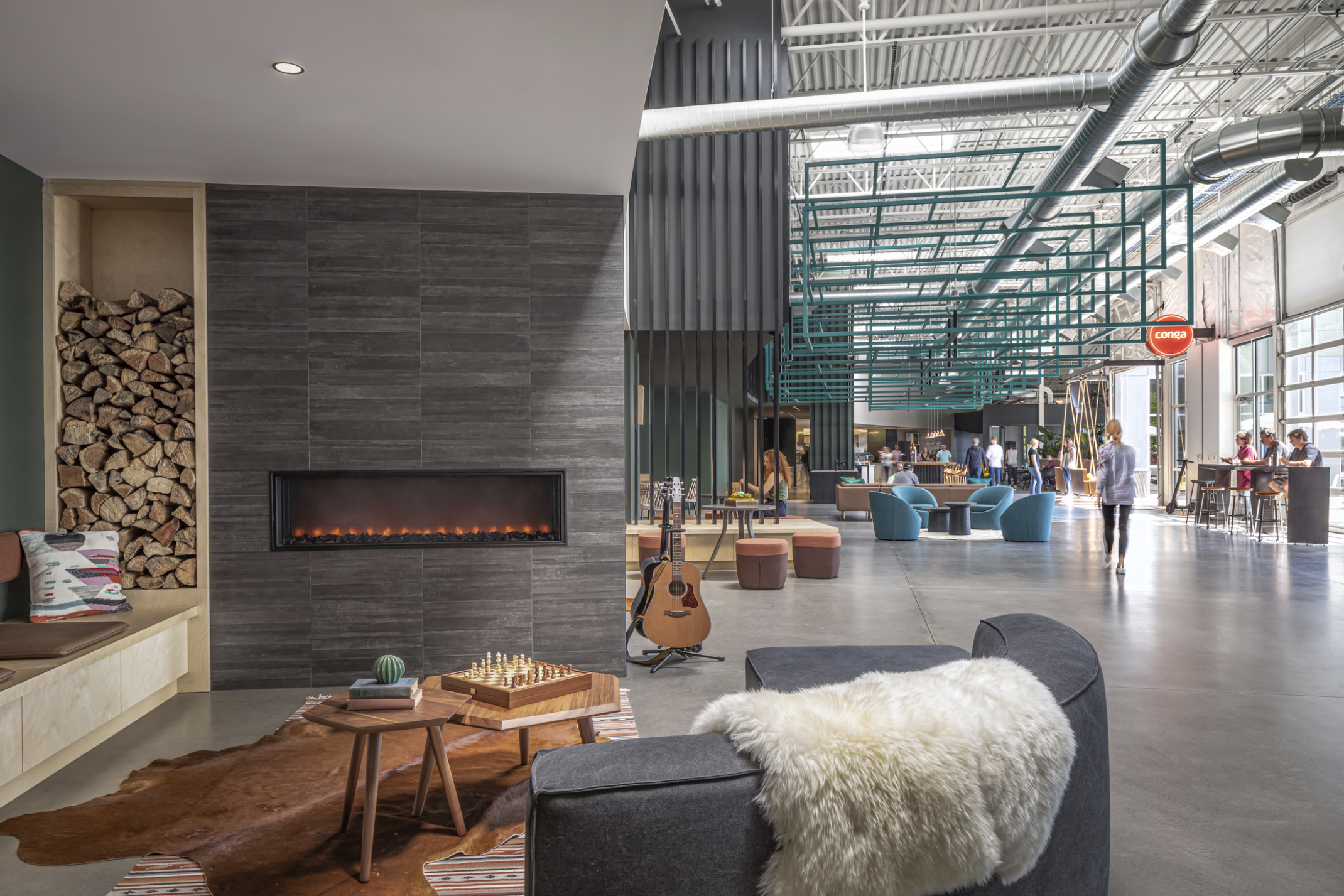 Fireplace with cozy seating in the heart of Conga Headquarters.