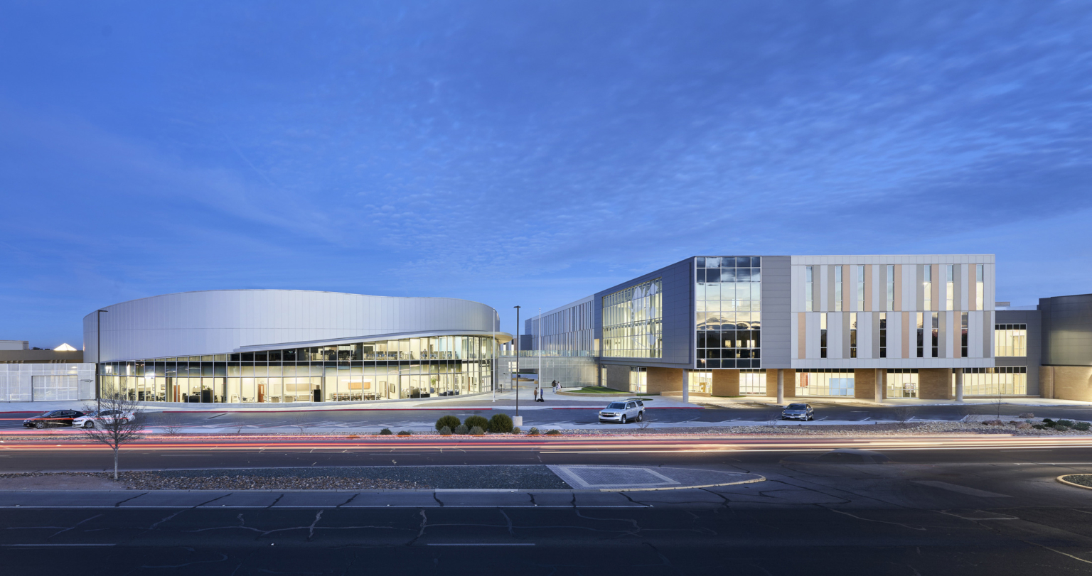 Evening view of curved building and addition at Eastwood High School.