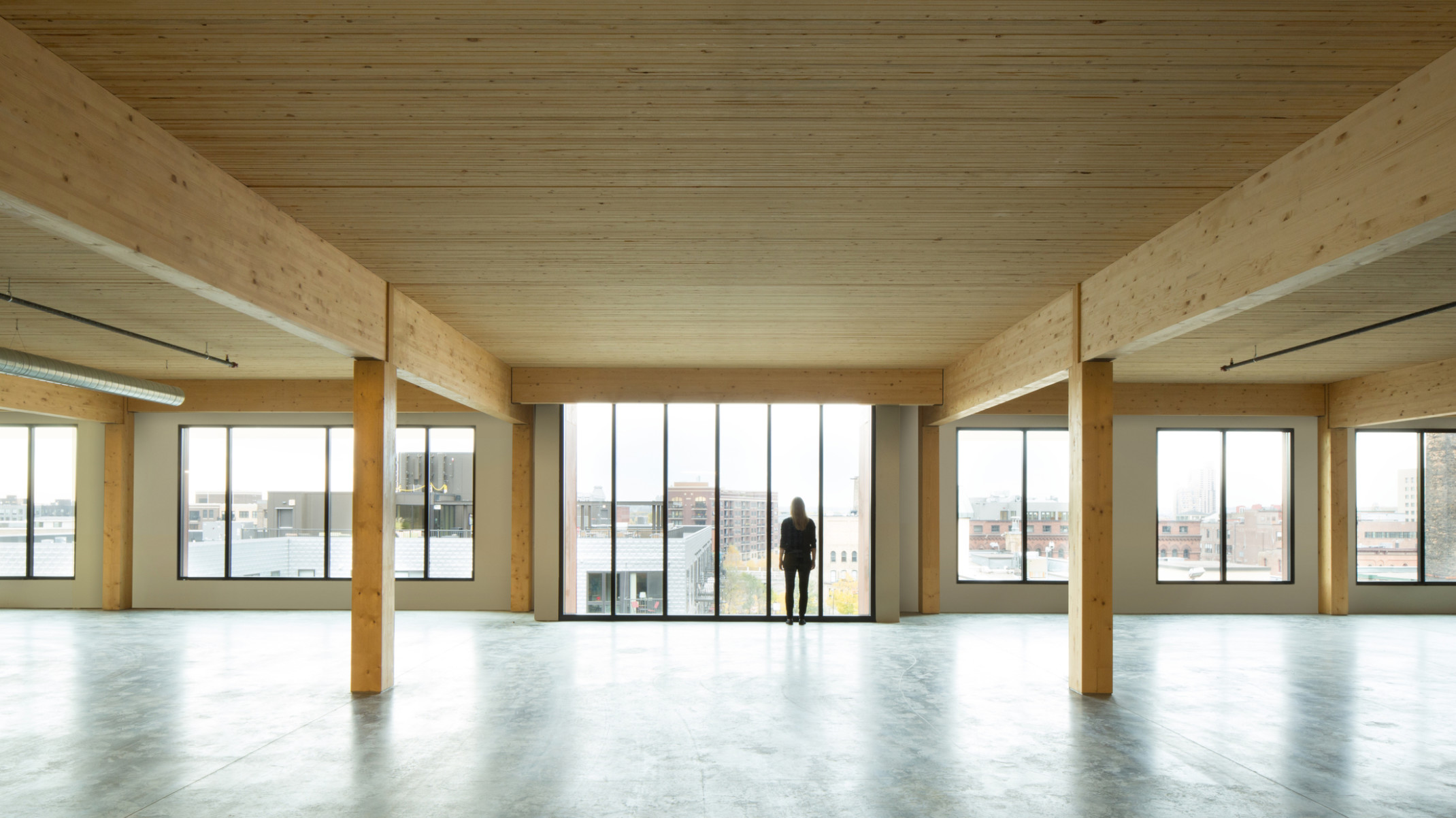 mass timber floor plate looking toward floor to ceiling windows