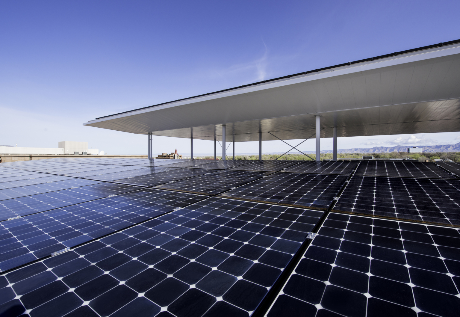 A solar array on the roof of the wayne aspinall federal building