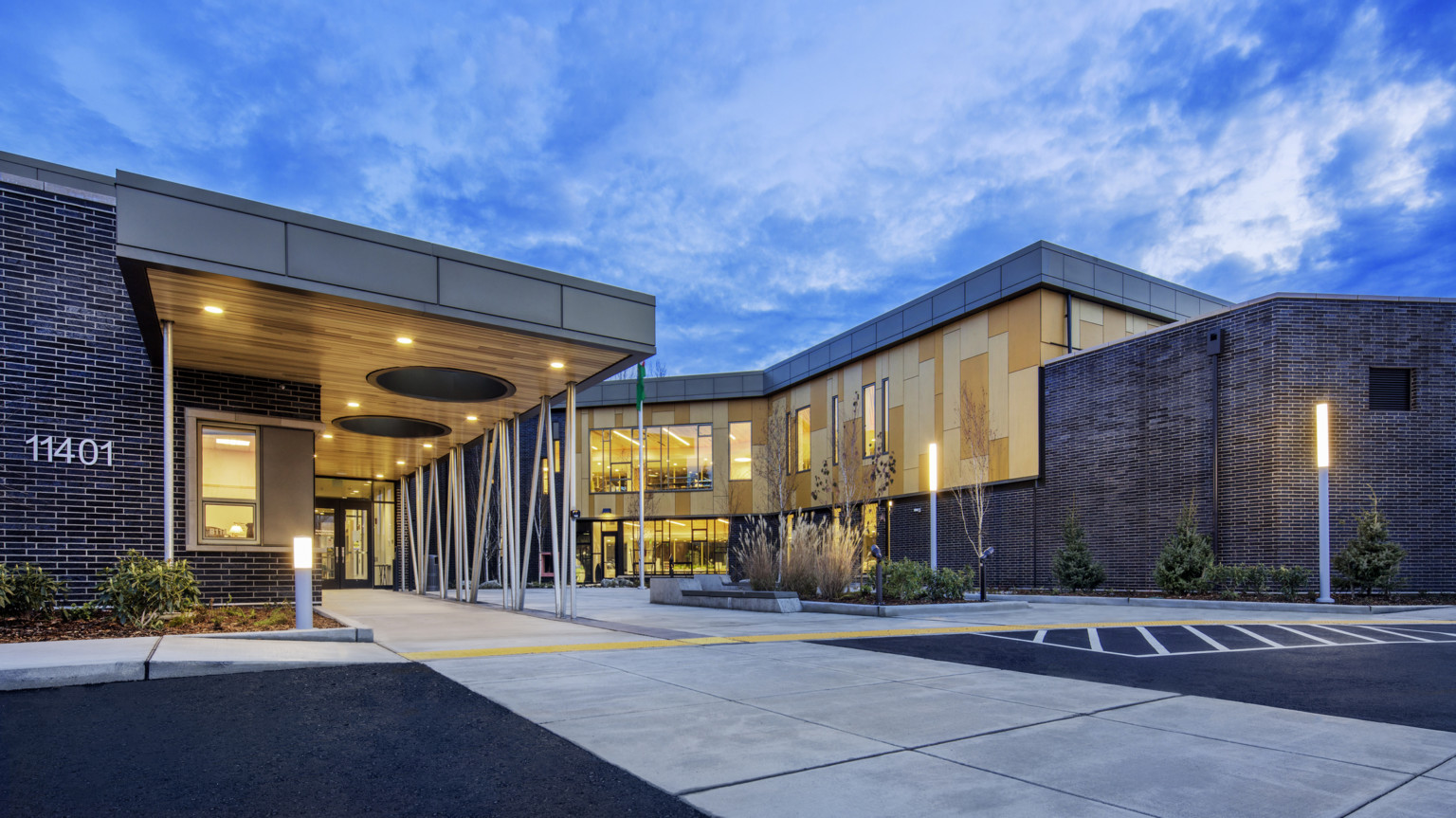 front entry sequence of Pathfinder Kindergarten Center illuminated at night front entry sequence of Pathfinder Kindergarten Center illuminated at night