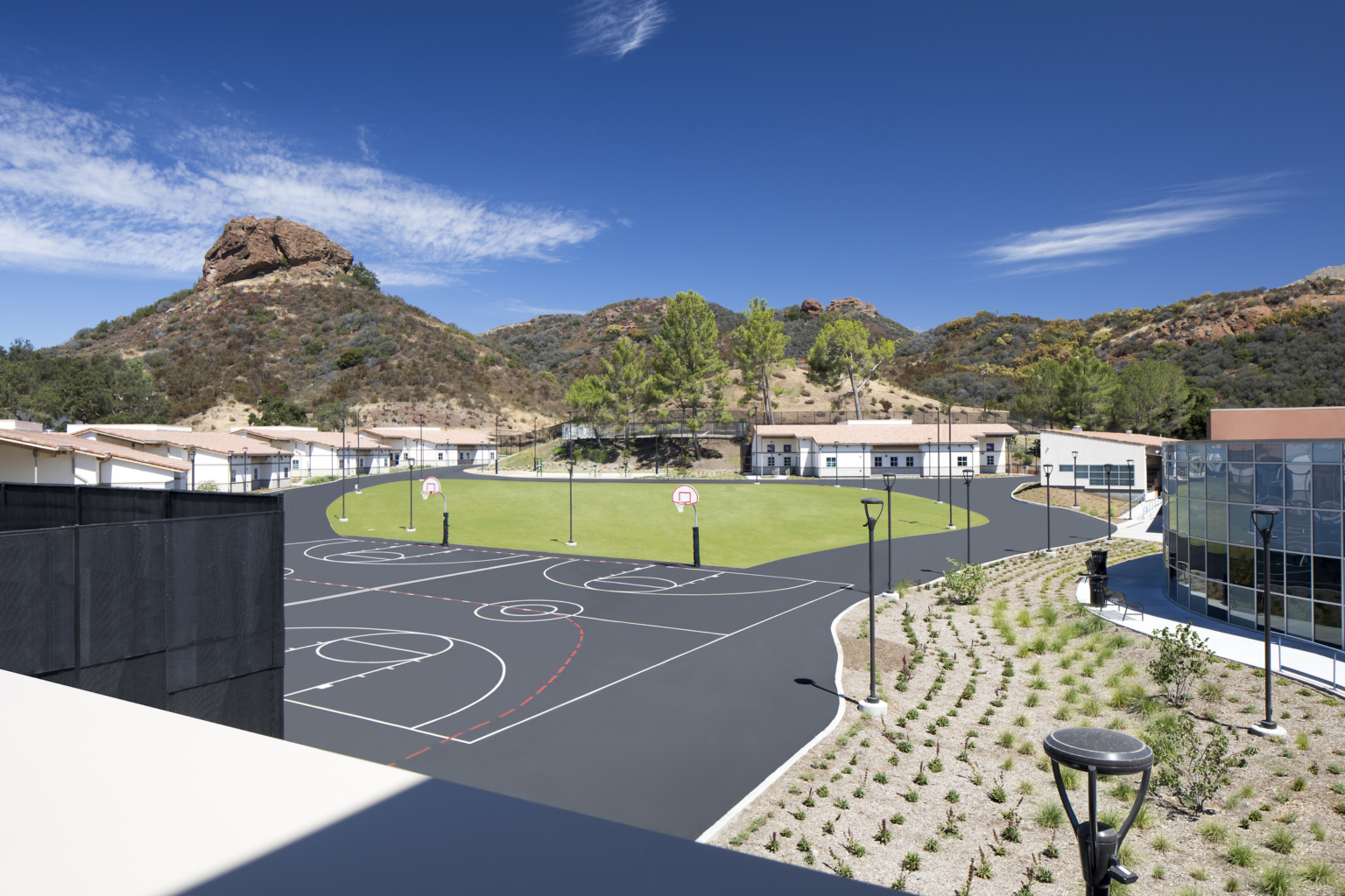LA County Campus Kilpatrick with basketball court and green grass LA County Campus Kilpatrick with basketball court and green grass