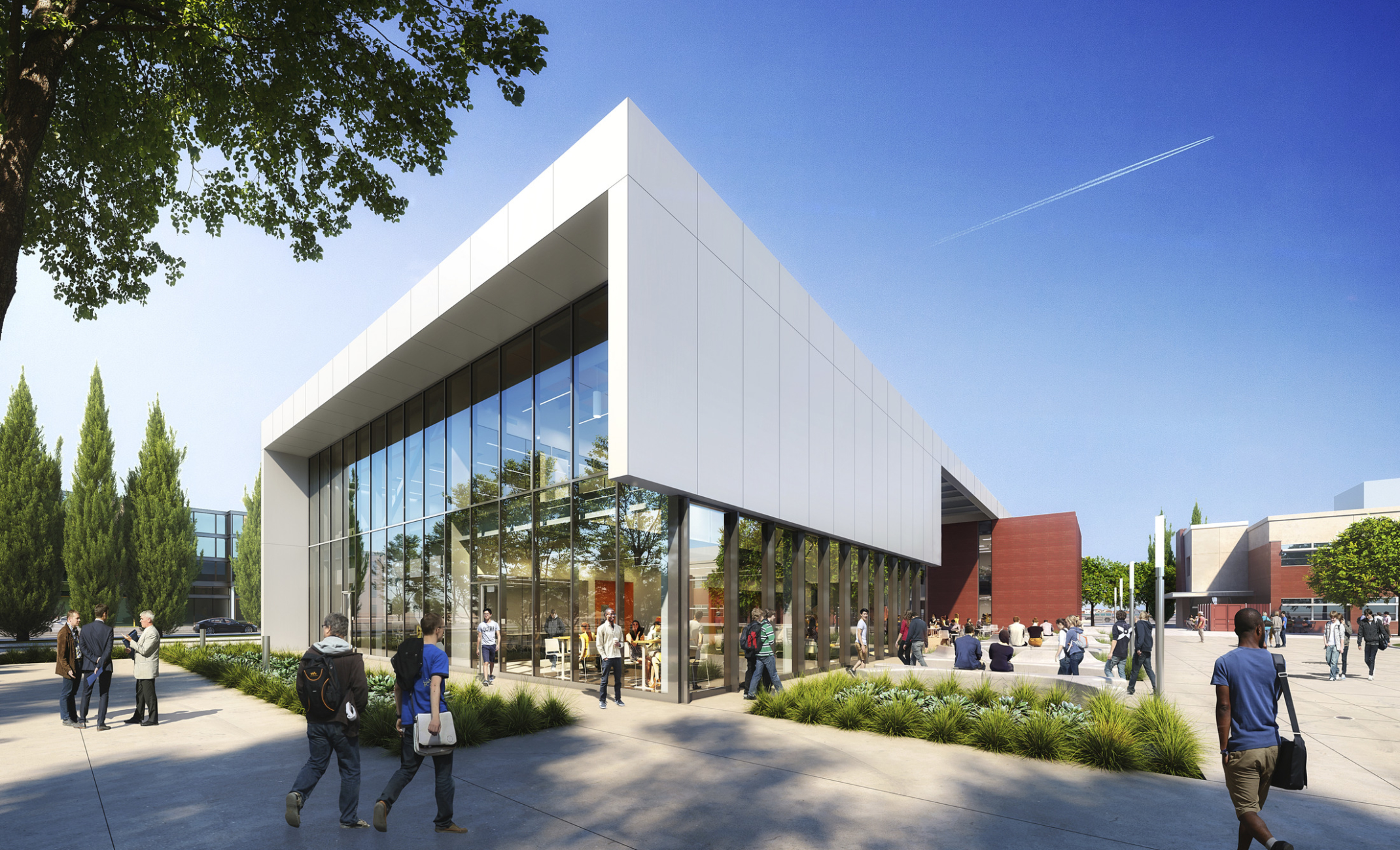 Exterior facade with large white roof wrapping two story glass windows at Los Rios Community College District Elk Grove Center.