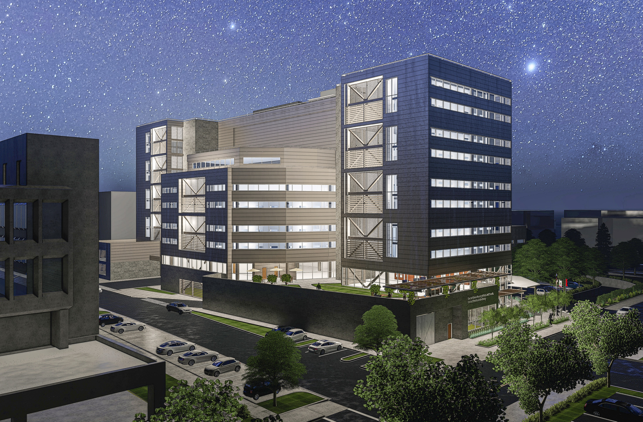 Night view with stars filling the sky overlooking the complex with large windows and a grey facade at Santa Clara County South Treatment and Re-Entry Facility. Night view with stars filling the sky overlooking the complex with large windows and a grey facade at Santa Clara County South Treatment and Re-Entry Facility.
