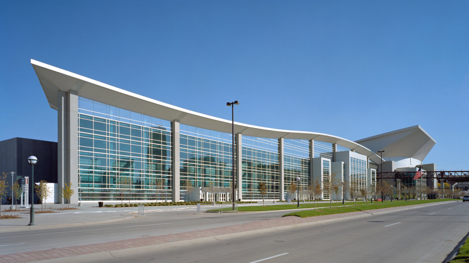 outdoor view of building with large windows and curved roof