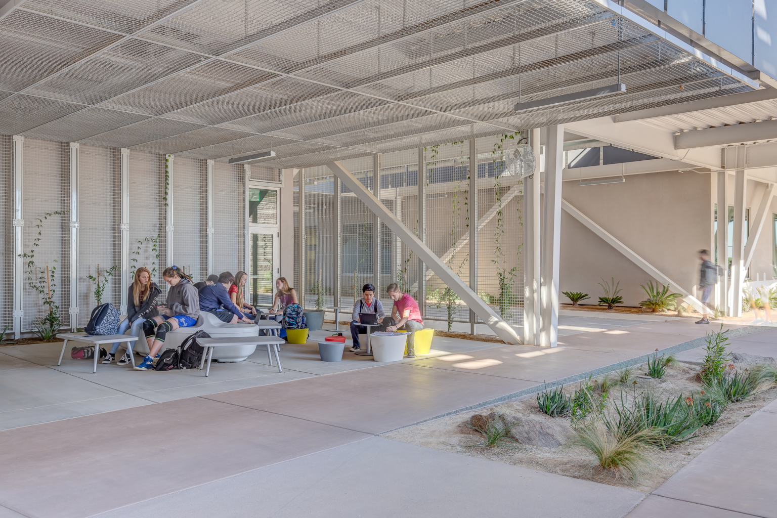 a shaded seating area under a solar canopy