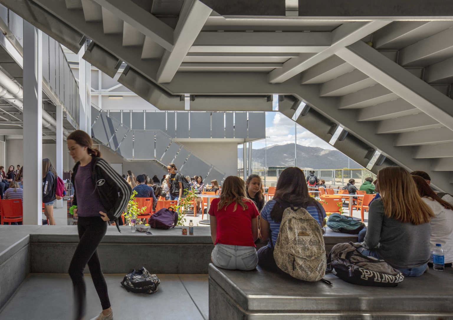 view of students in a covered, multiple story outdoor seating area at canyon view high school view of students in a covered, multiple story outdoor seating area at canyon view high school