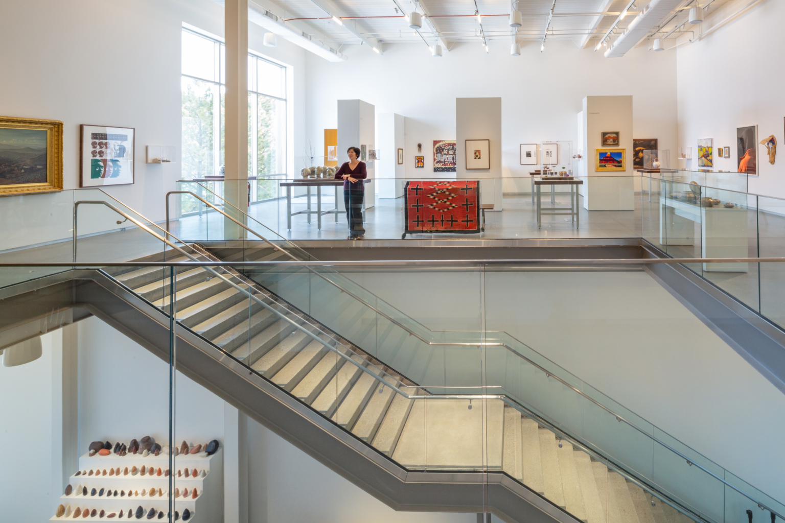 Two story art gallery with white walls and custom lighting at the University of Nevada, Reno University ARts Building