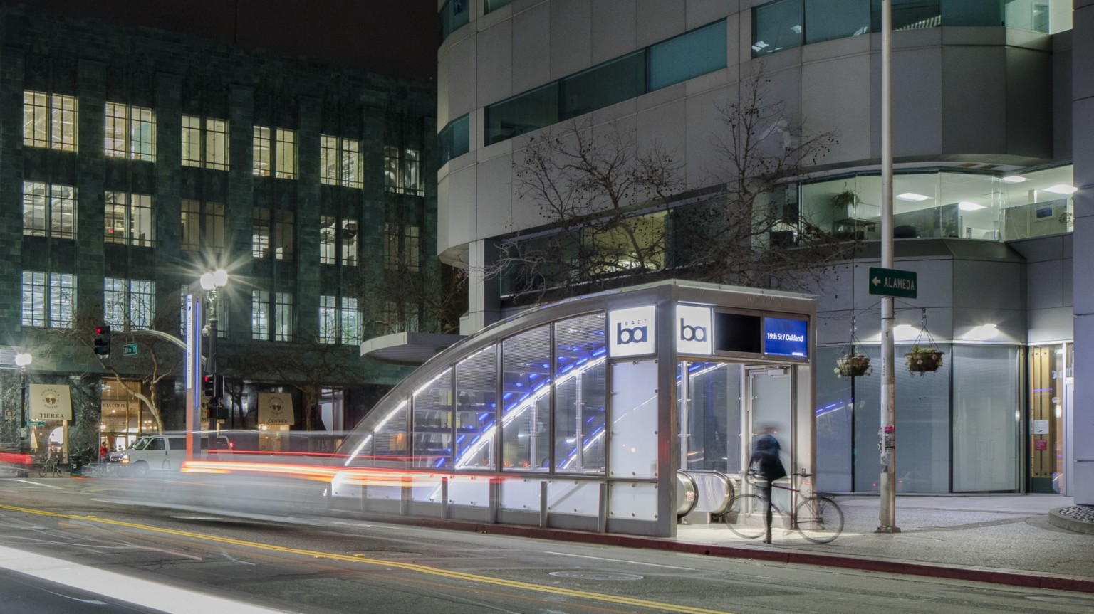 night view of city street level entrance to underground subway station