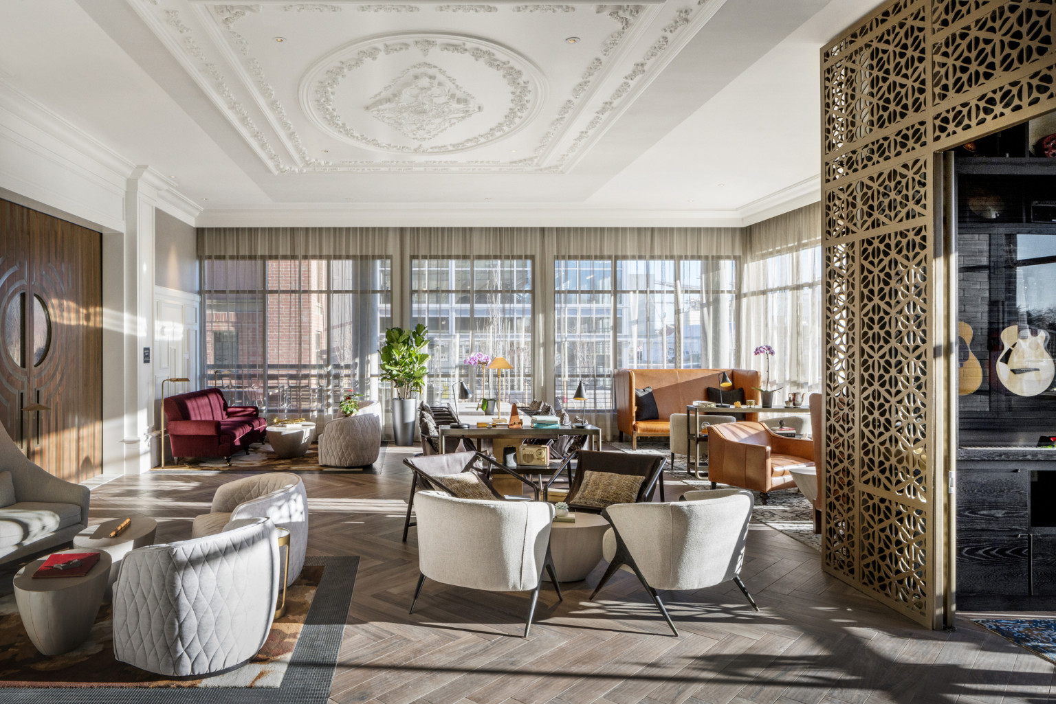 lobby with white seating and ornate ceiling with crown molding at the The Elizabeth Hotel, Autograph Collection by Marriott