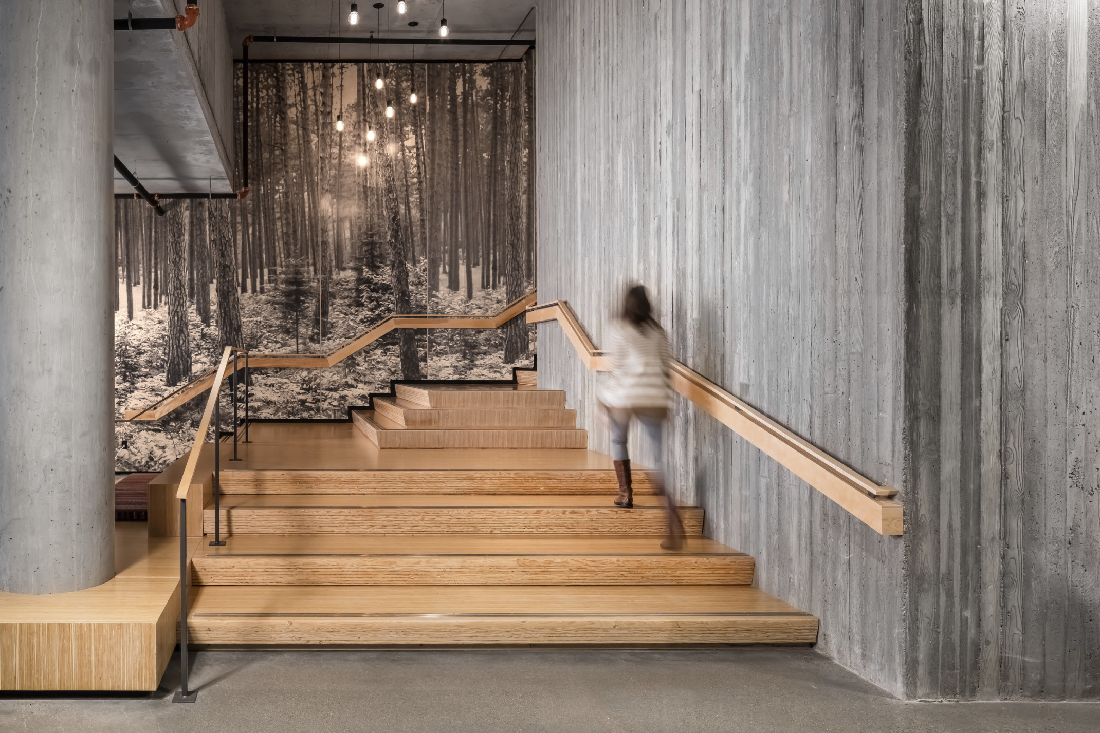 woman walking up wooden stairs