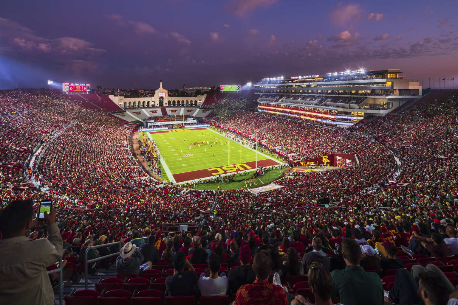 Full stadium bowl during dusk game at the LA Memorial Coliseum Full stadium bowl during dusk game at the LA Memorial Coliseum