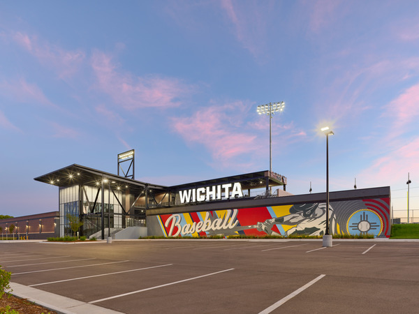 Stadium entrance from the parking lot and baseball mural painted on the exterior side of the building Stadium entrance from the parking lot and baseball mural painted on the exterior side of the building