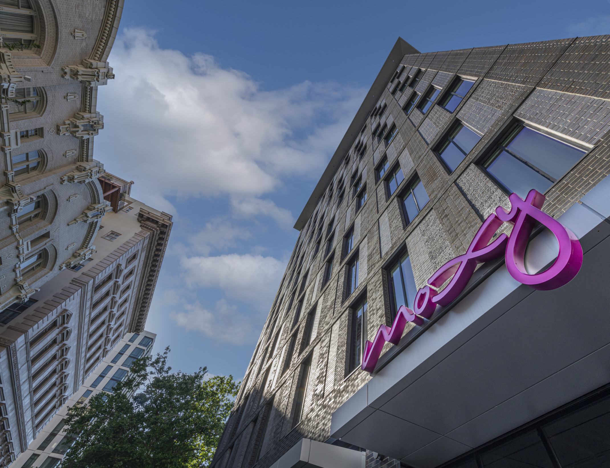 view of the exterior of the moxy hotel in downtown portland from the street looking up view of the exterior of the moxy hotel in downtown portland from the street looking up